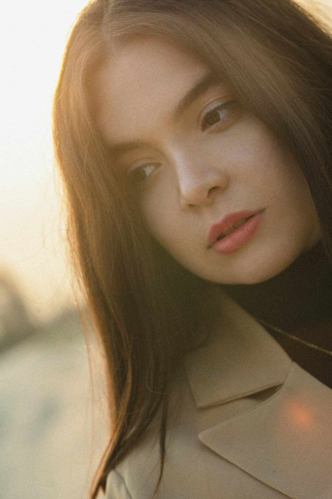 Portrait of a woman with long dark hair in a blazer